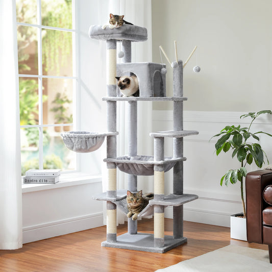 Light gray cat tree in a living room by the window