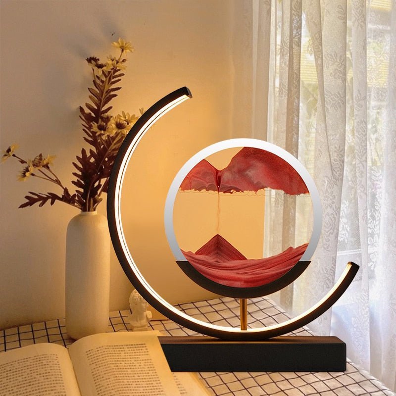 Duna moving sand lamp glowing warmly on a cabinet