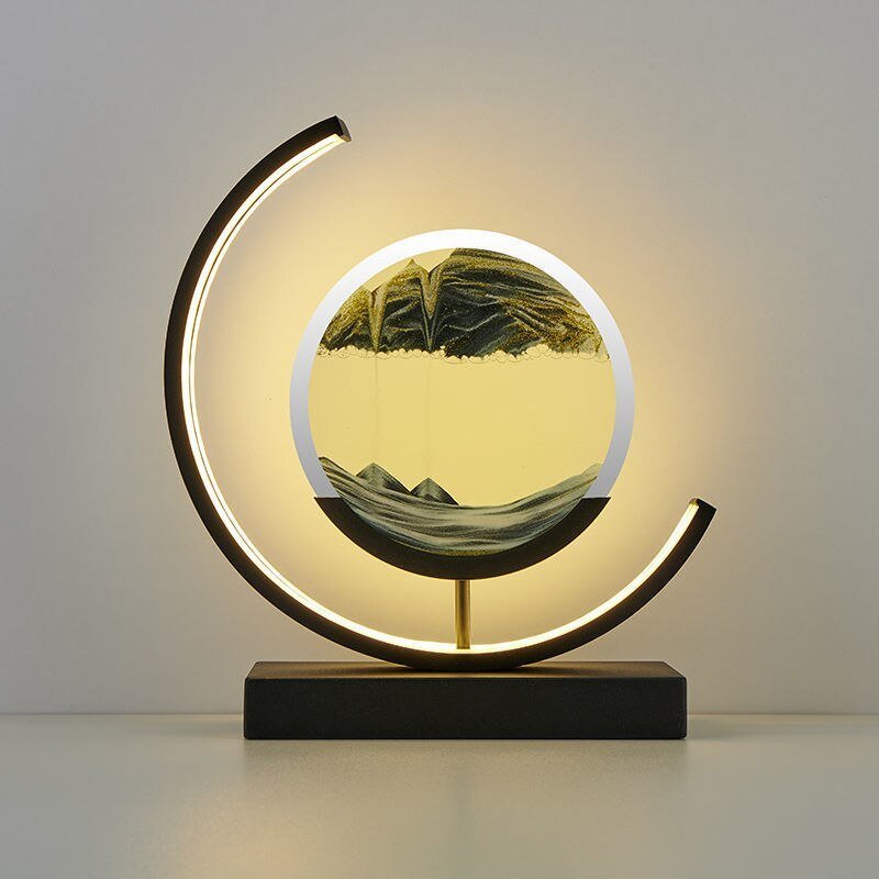 Duna moving sand lamp next to books on a shelf