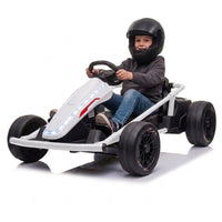 Kid in a helmet driving the white 24V electric drift go kart