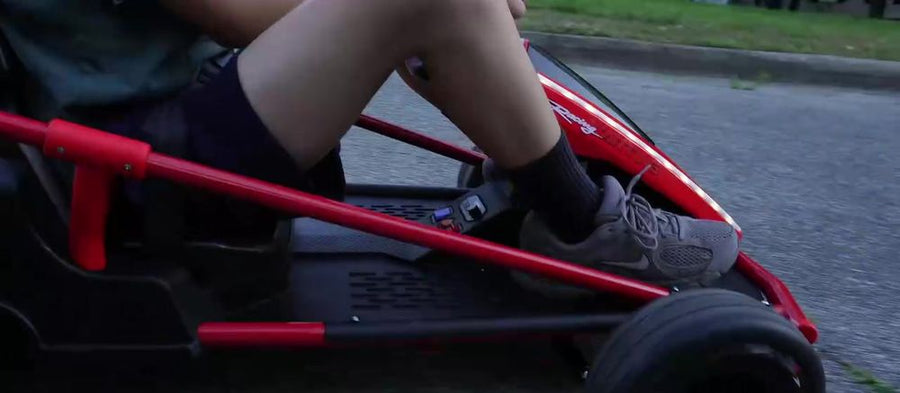 Rider's feet on the gas and brake pedals