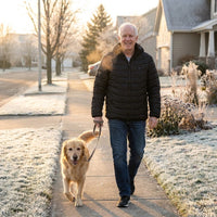 Man walking his dog on a frosty morning in the heated jacket