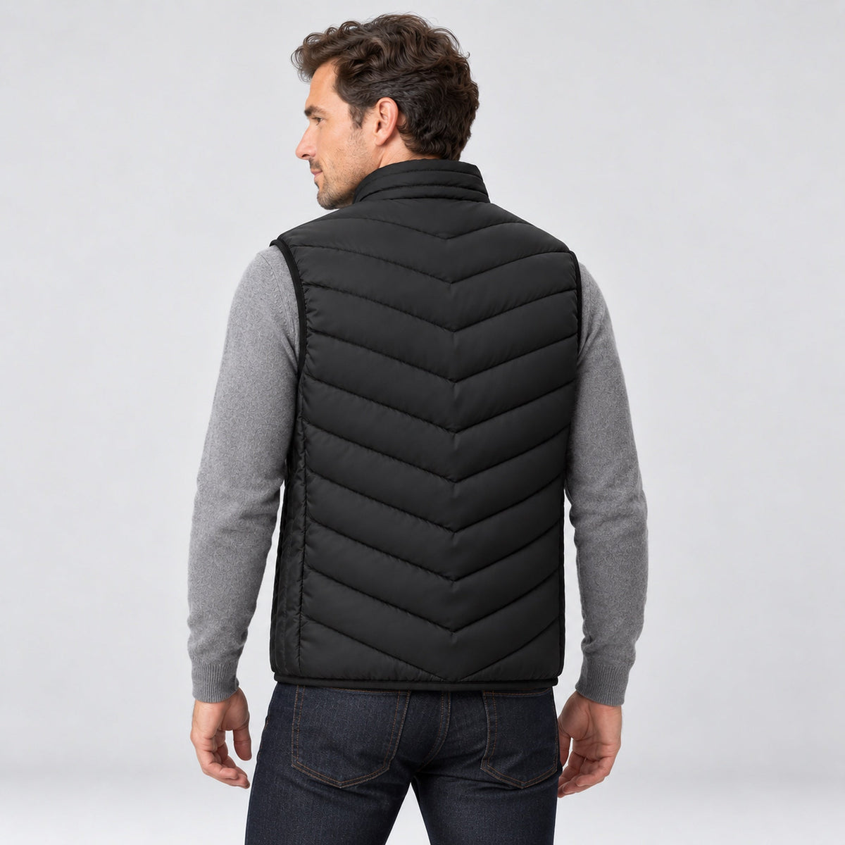 Man wearing the heated vest, back view