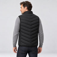 Man wearing the heated vest, back view